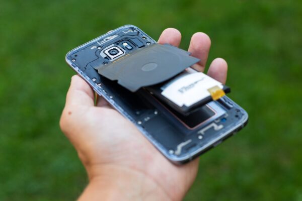 Photo of swelling battery pushing apart internal components of a phone