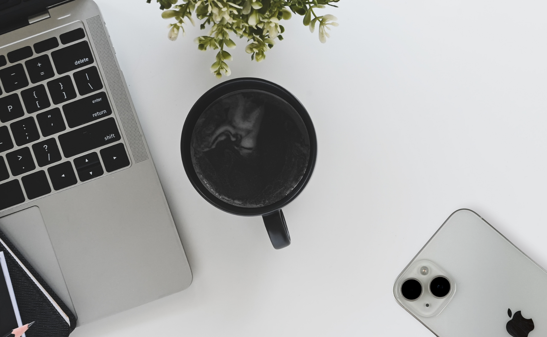Iphone 14 Colours: A Style Guide For Every Shade Iphone 14 in starlight on minimalist white desk