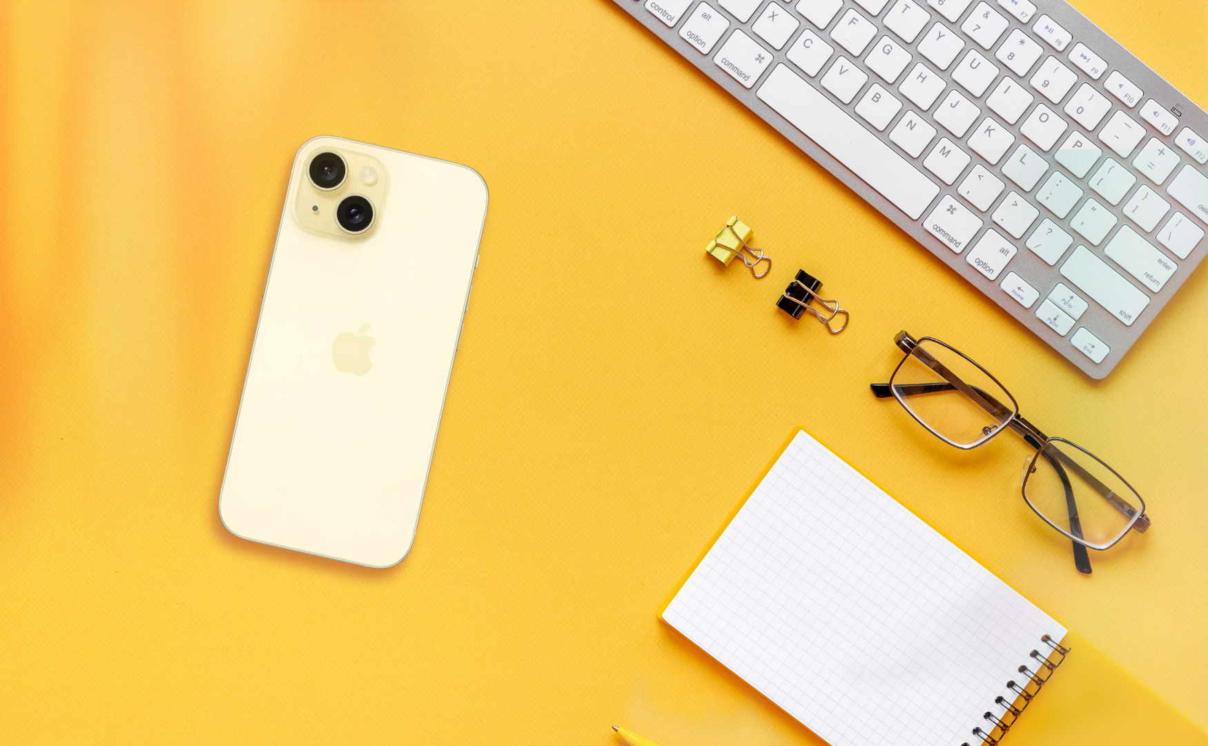 Iphone 15 Colours: Which One Matches Your Mood? Iphone 15 colours: yellow on yellow desk