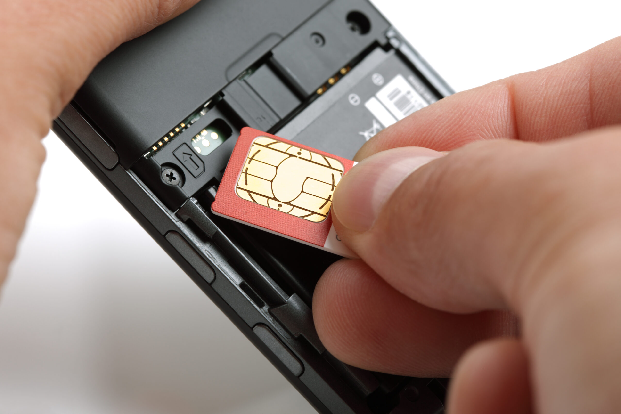 Unlocked Phones: What It Really Means Inserting, a, sim, card, into, the, back, of, an, unlocked phone