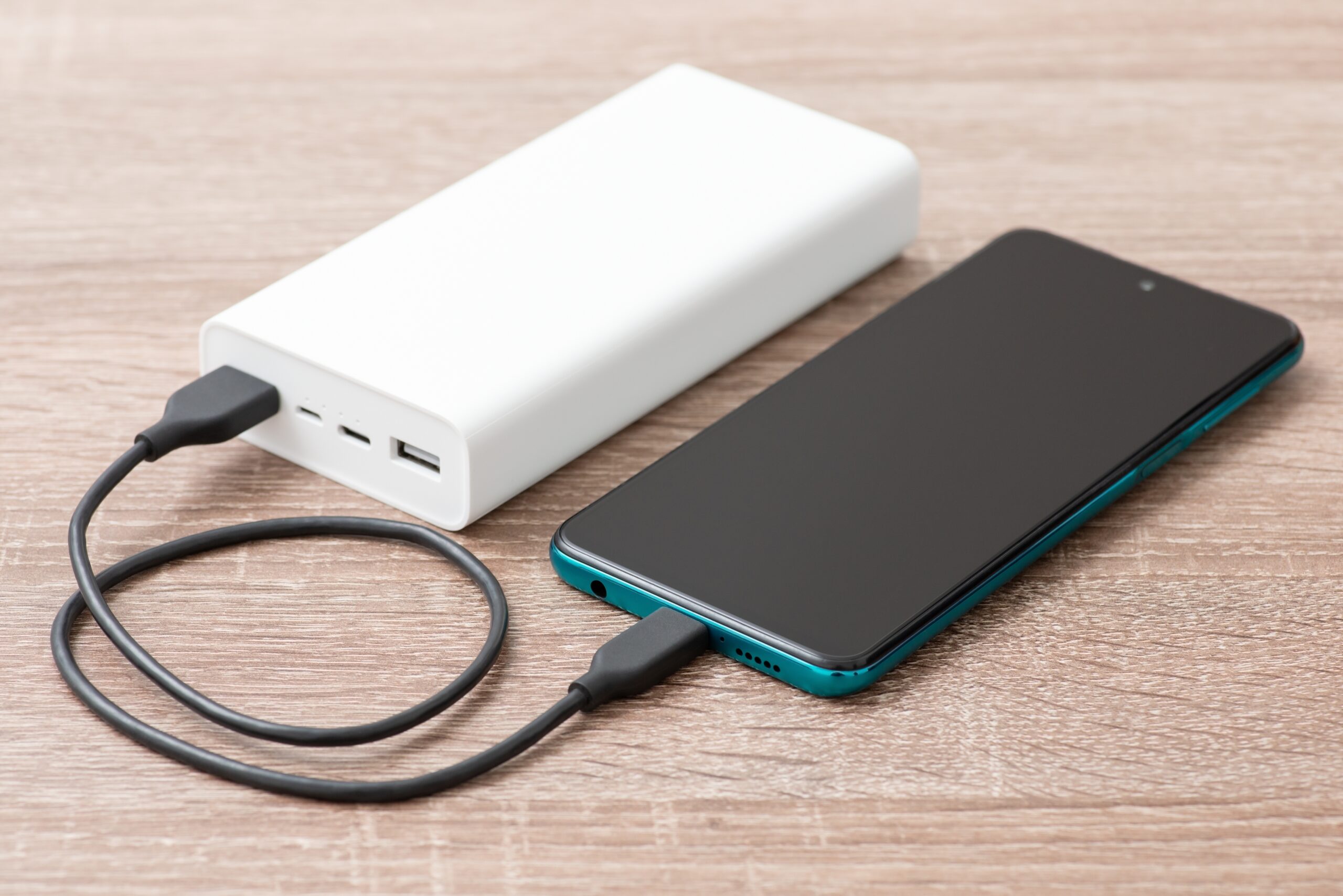 The Ultimate Guide To Charging Your Phone: Tips, Tools &Amp; Smart Habits Phone connected to powerbank, ways to charge your phone