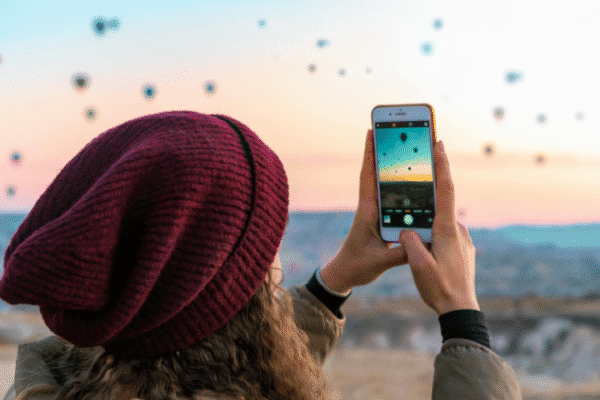 Women using unlocked phone on holiday