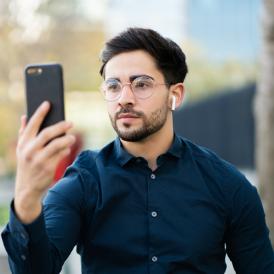 Man attempting to use face id on phone